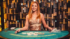 Sic Bo table display showing three dice and betting grid with payout options